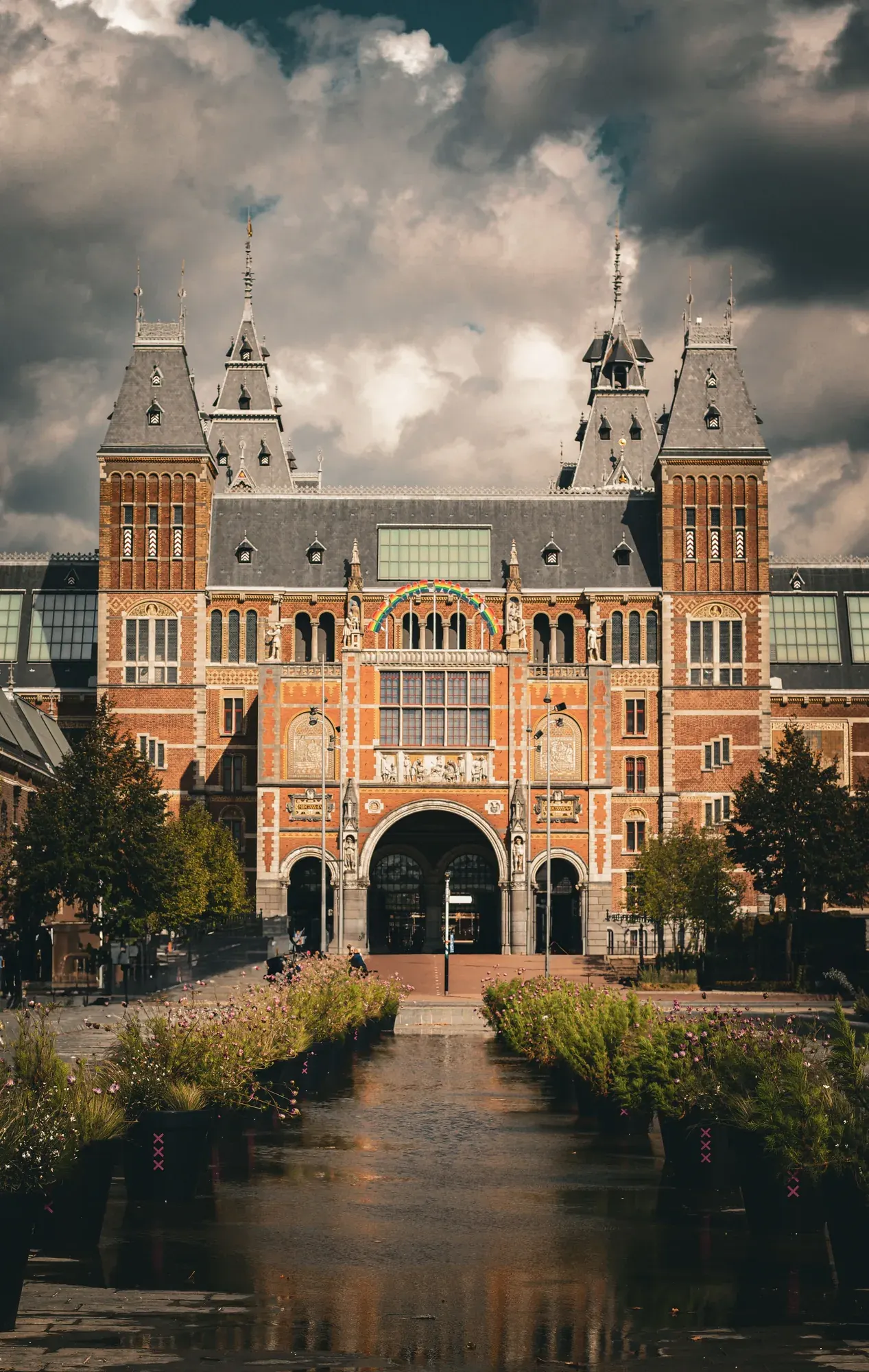 The Rijksmuseum facade seen across the pond on Museumplein, Amsterdam