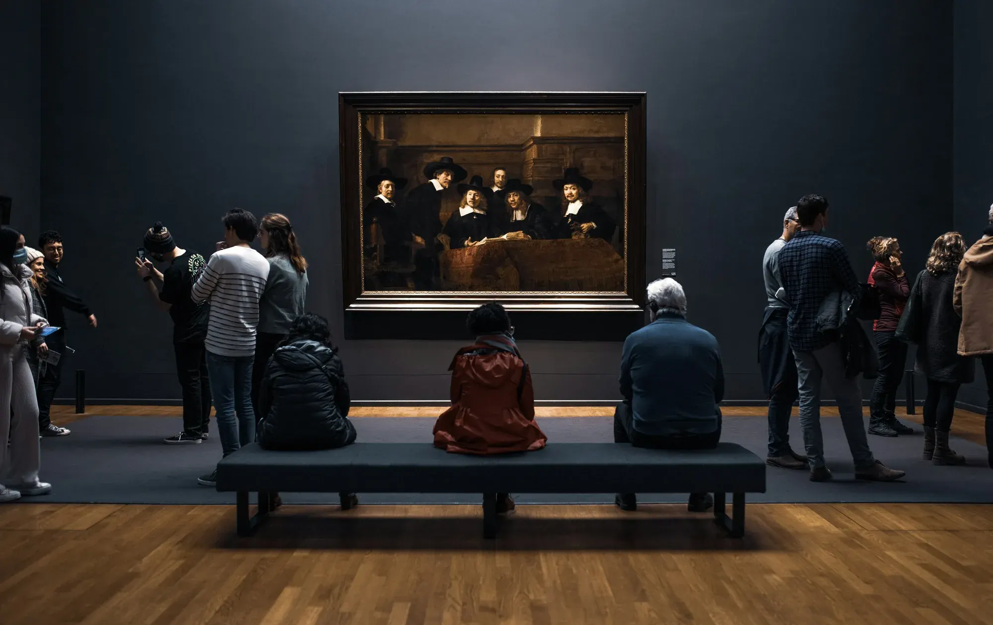 Visitors in front of Rembrandt's The Syndics at the Rijksmuseum, Amsterdam