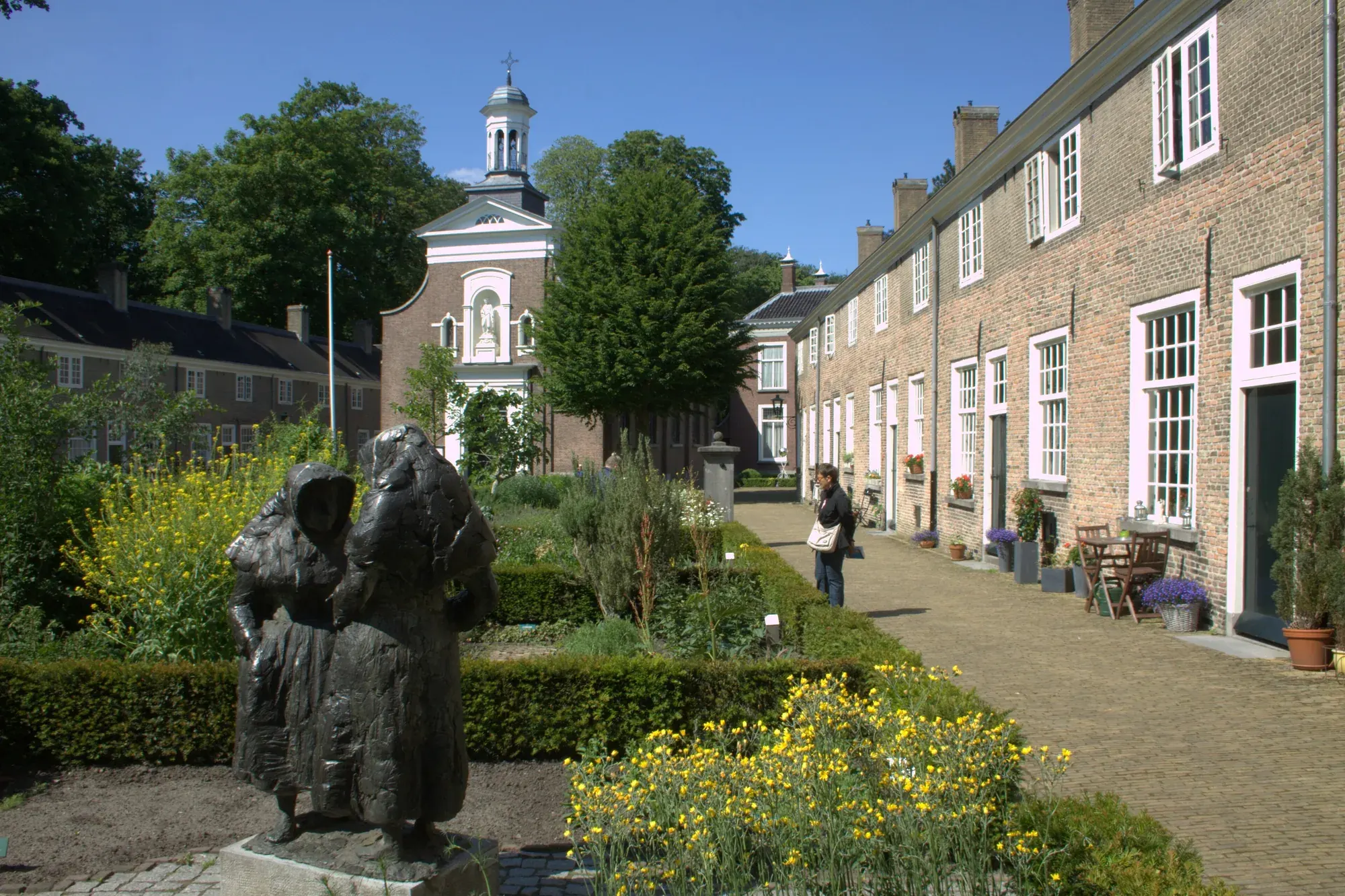 The garden courtyard of the Begijnhof in Breda, lined with small brick houses