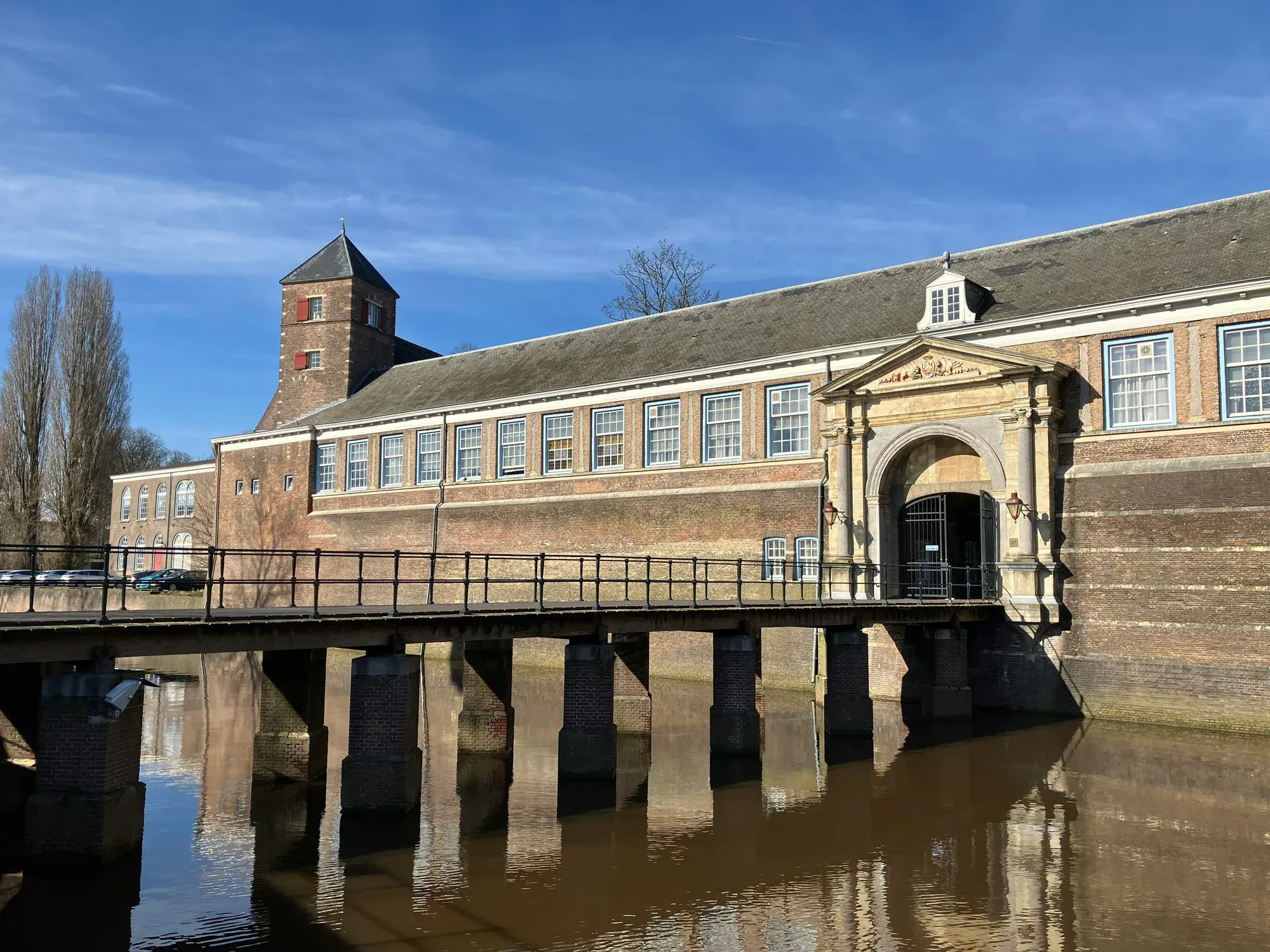 The baroque gate of the Castle of Breda across its moat, with the bridge leading to it