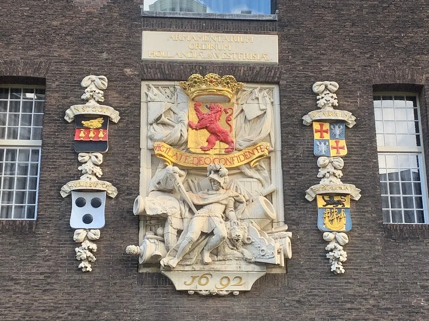 A 1692 facade relief with heraldic crests on the Armamentarium building, Delft