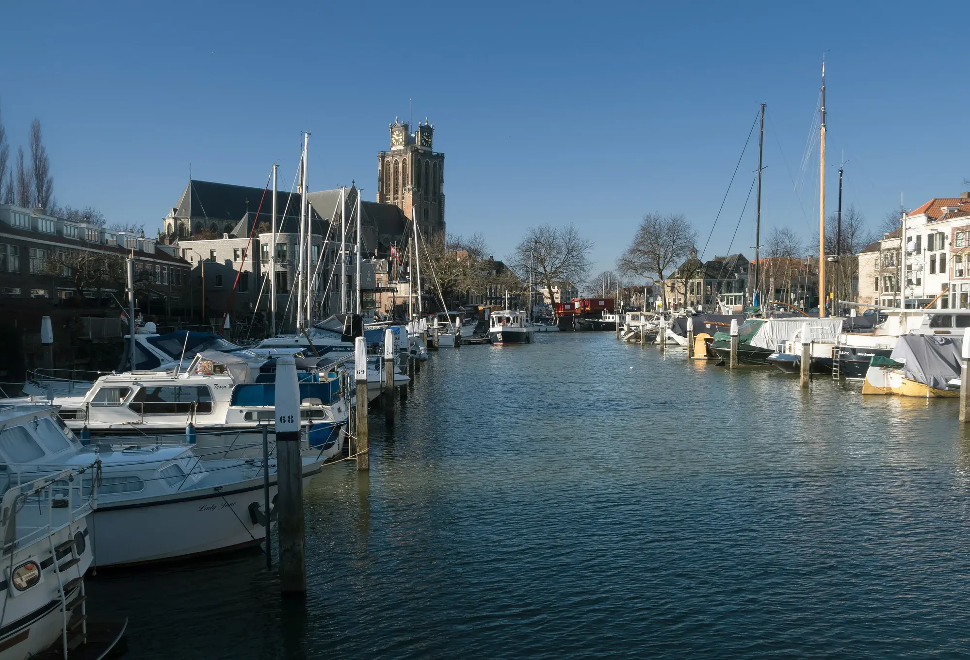 The tower of the Grote Kerk in Dordrecht seen along the water from the Lange IJzeren Brug