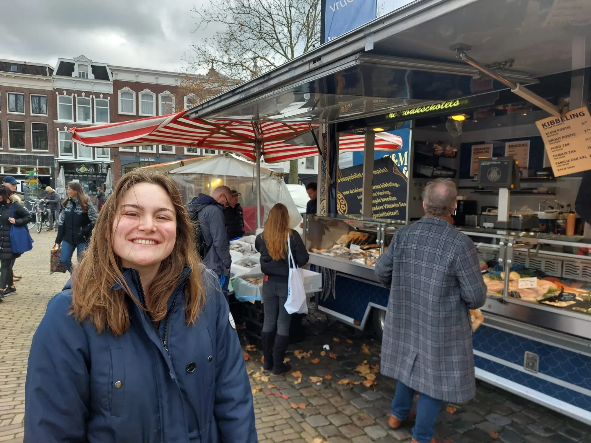 A guide at the fish market stall on the Markt, Gouda
