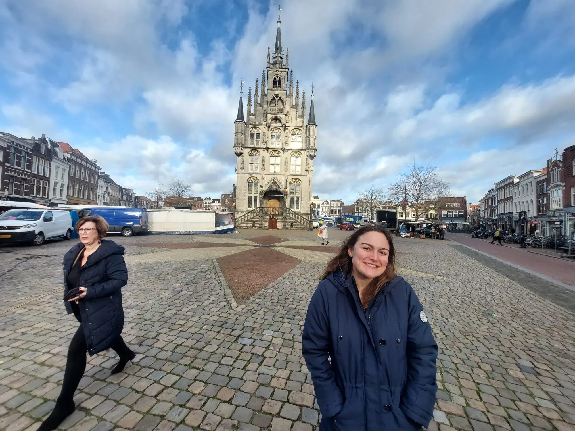 Tour guests entering a historic covered passage, Gouda