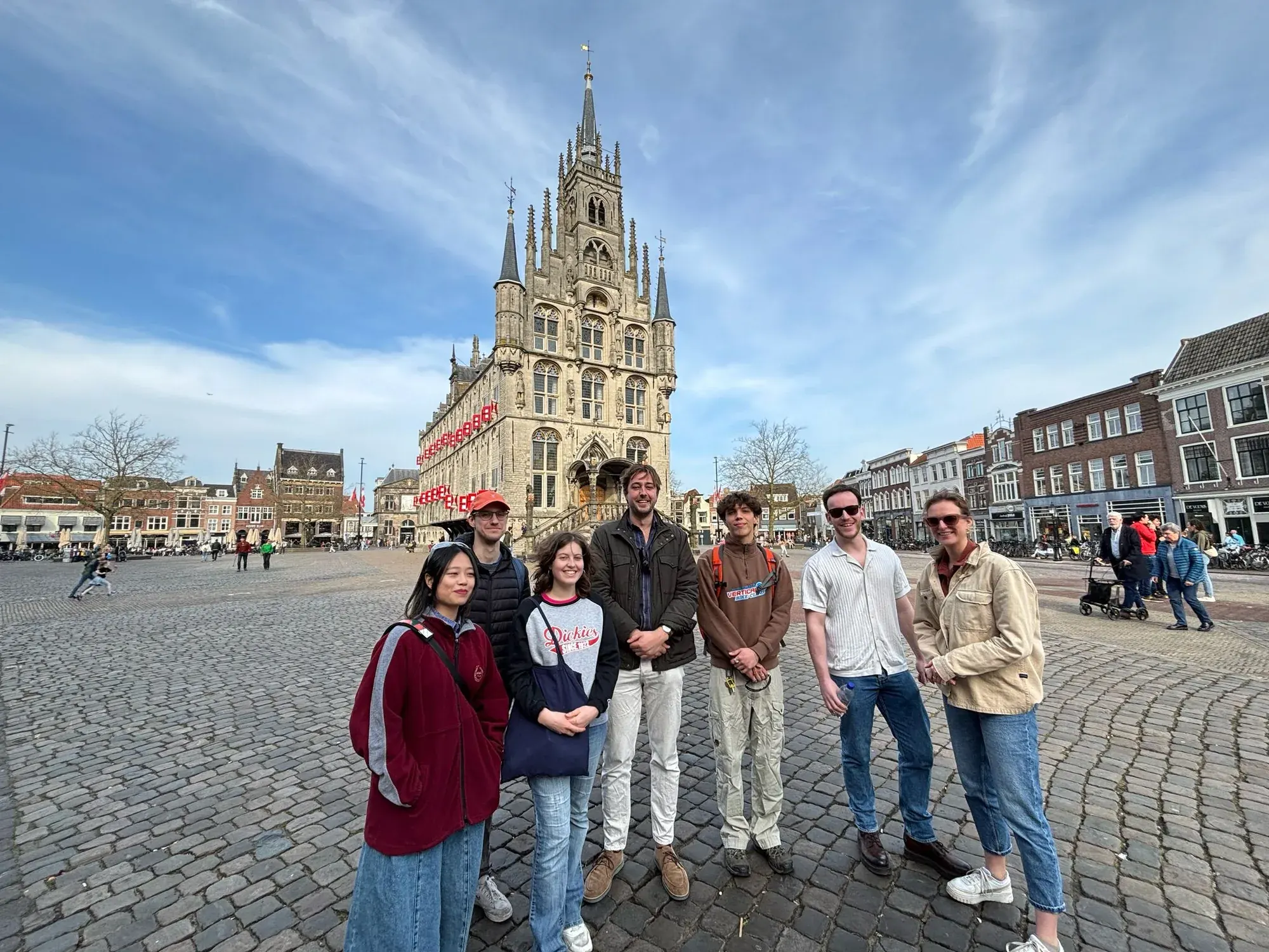 A tour group in front of Gouda's Gothic Stadhuis