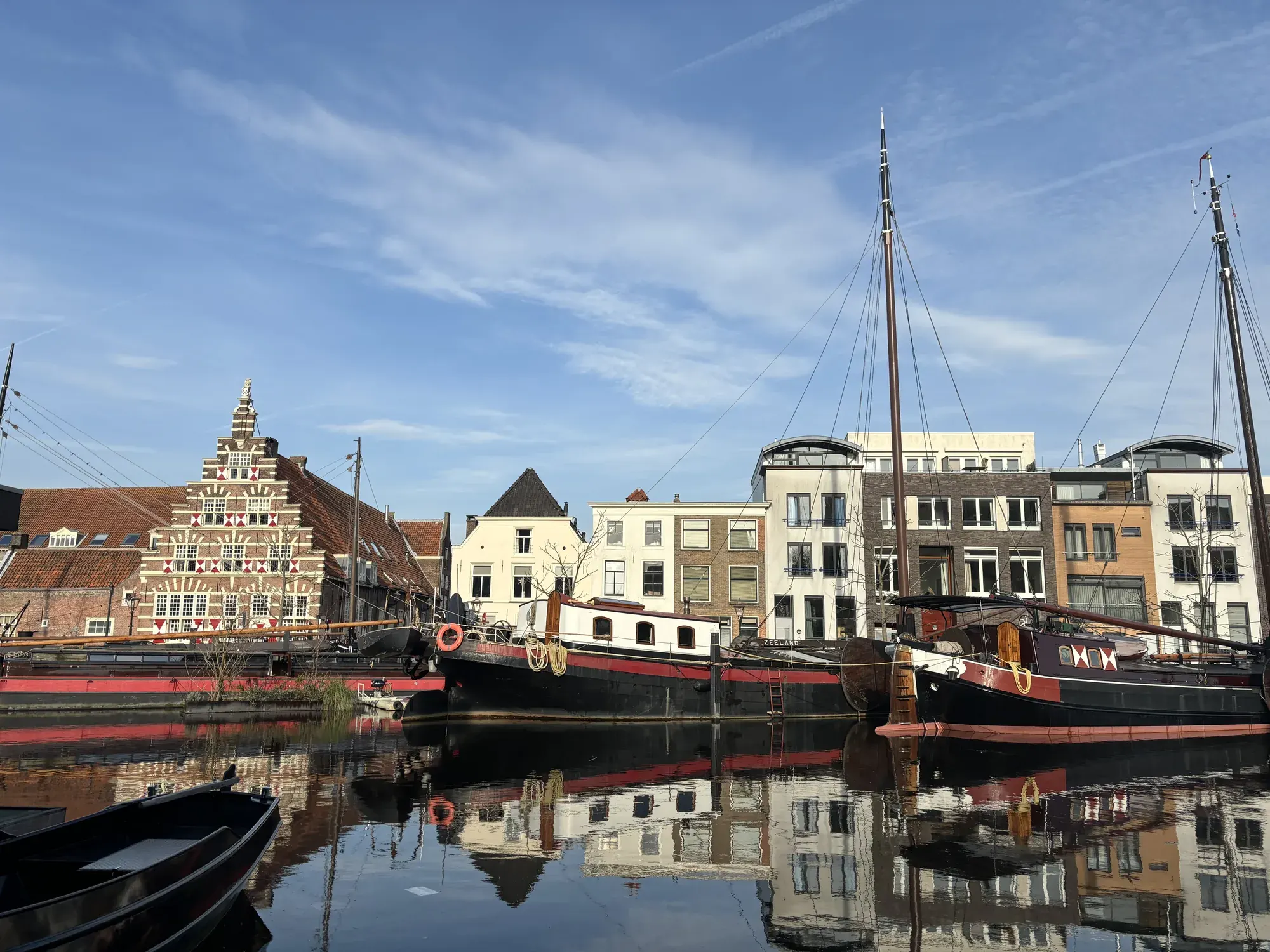 Historic sailing ships moored on the Galgewater in front of an old warehouse, Leiden