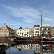 Historic sailing ships moored on the Galgewater in front of an old warehouse, Leiden