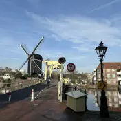 Windmill De Put beside a yellow drawbridge on the Galgewater, Leiden