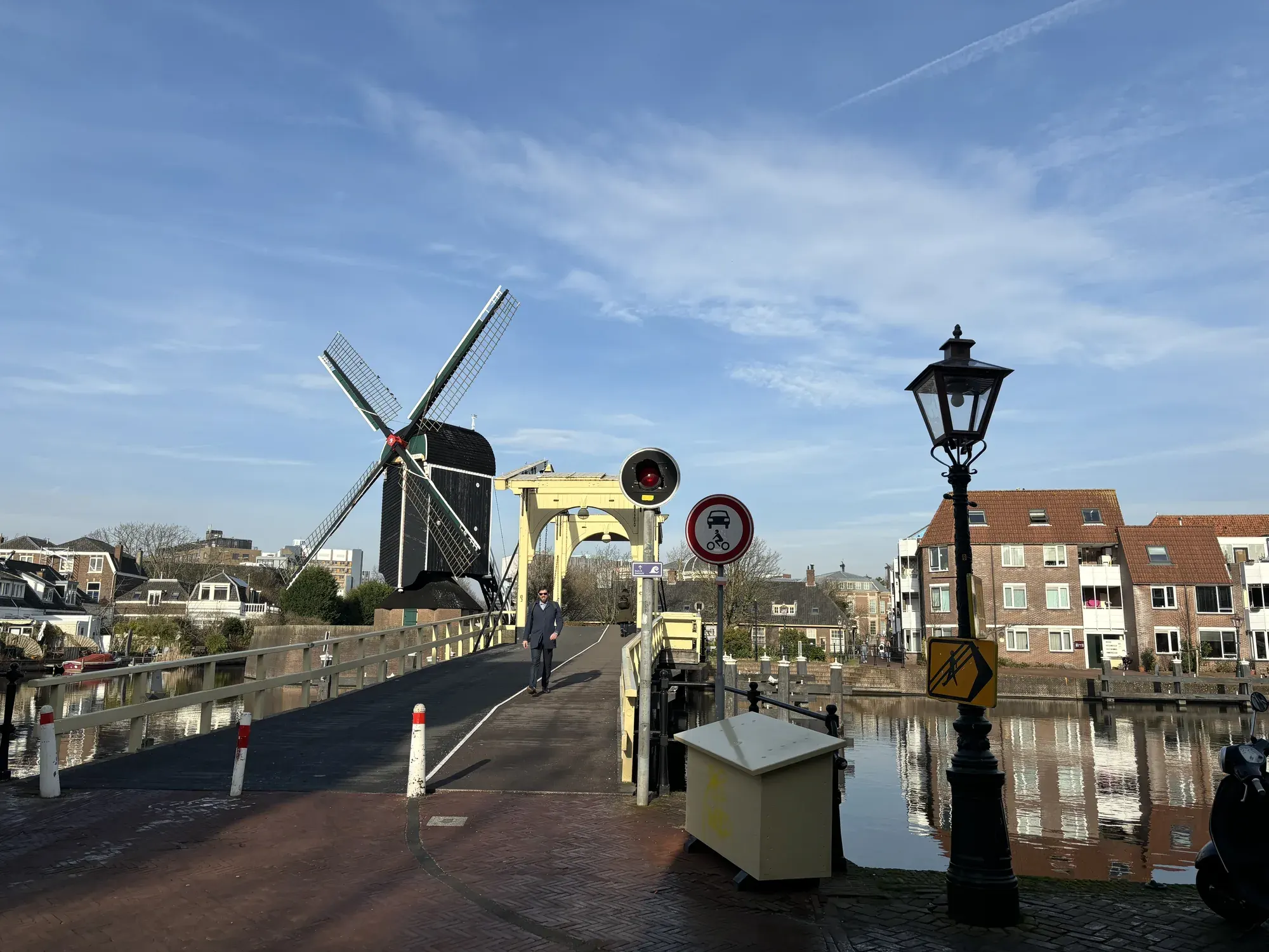 Windmill De Put beside a yellow drawbridge on the Galgewater, Leiden