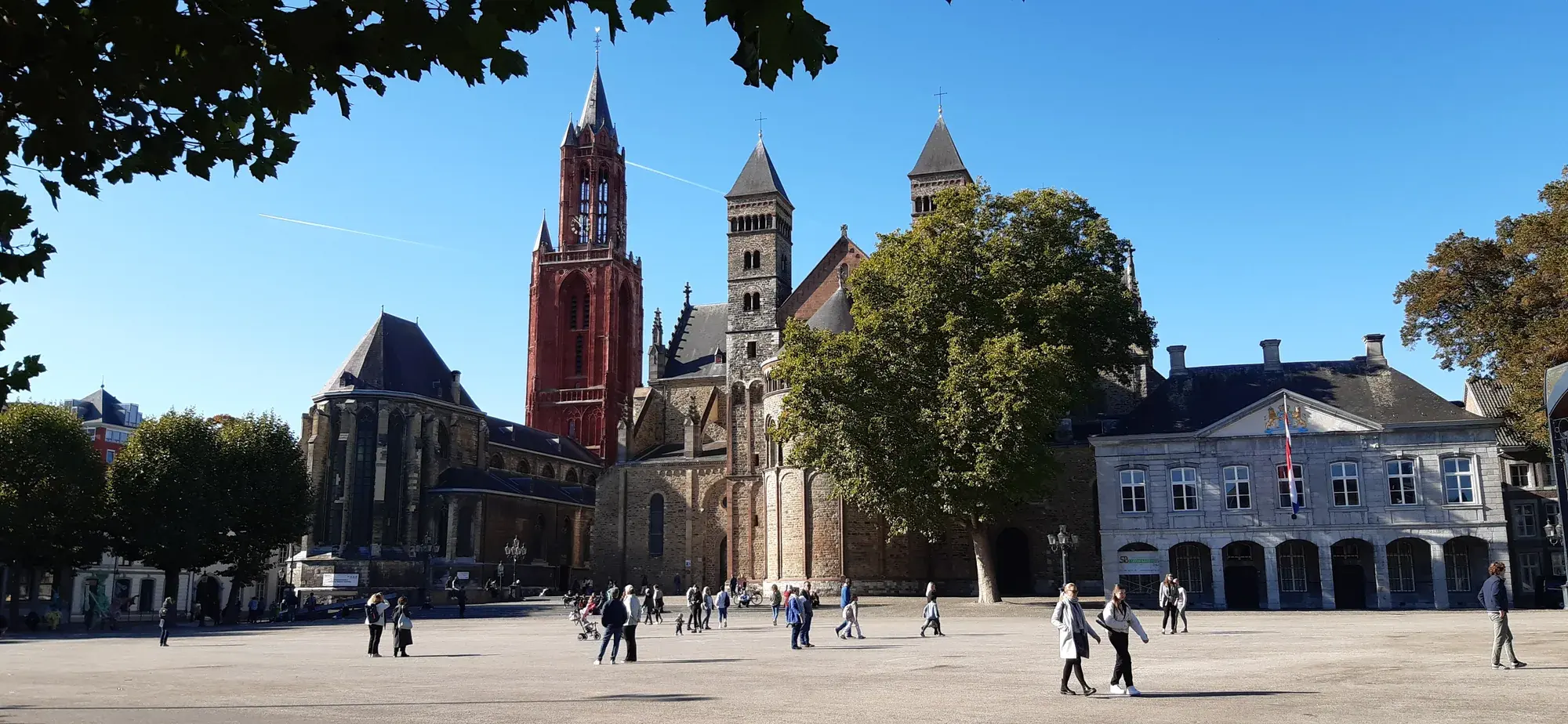 The Vrijthof square in Maastricht with the red tower of Sint-Janskerk and the Sint-Servaasbasiliek