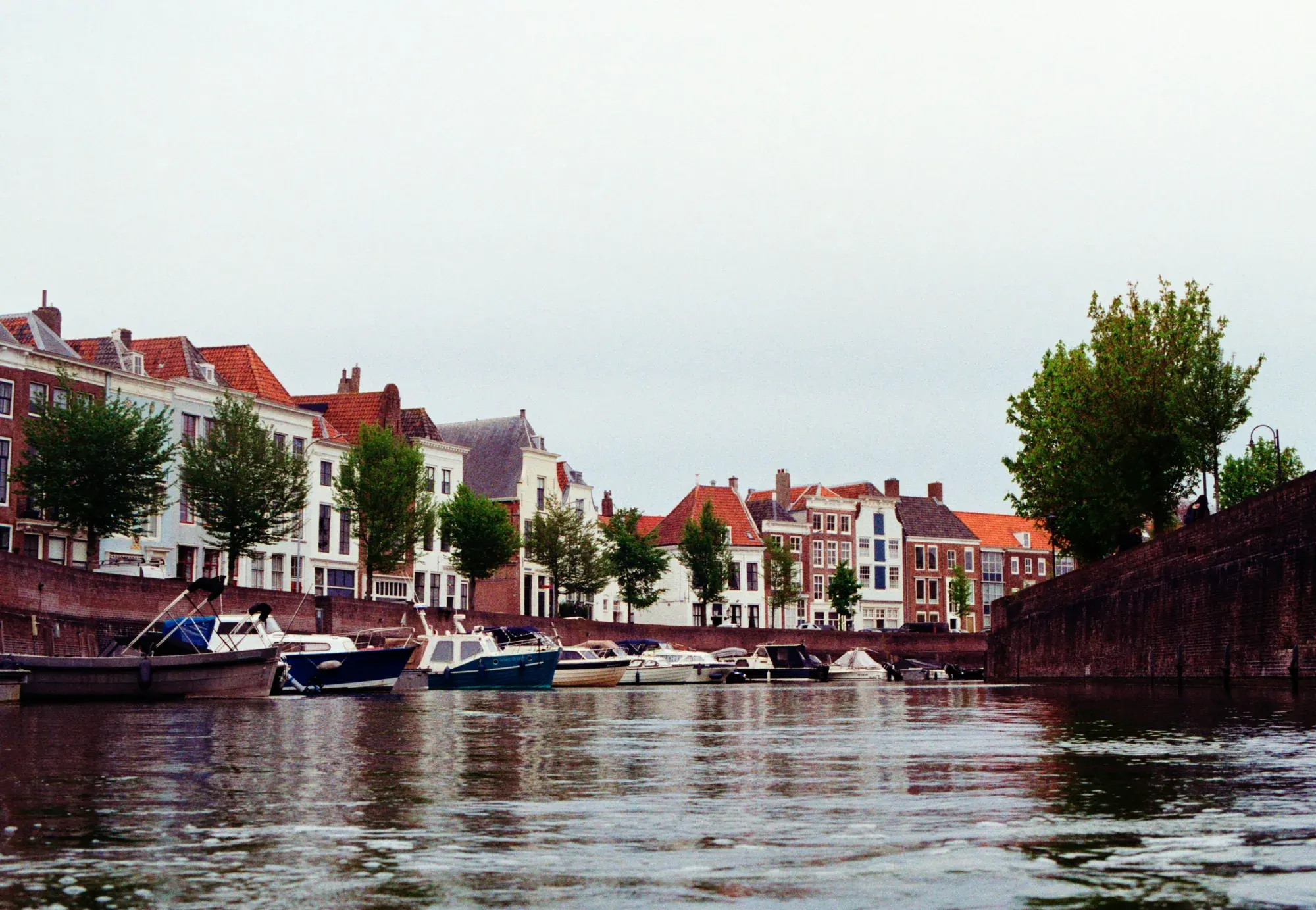 Boats moored along the canal quay in Middelburg