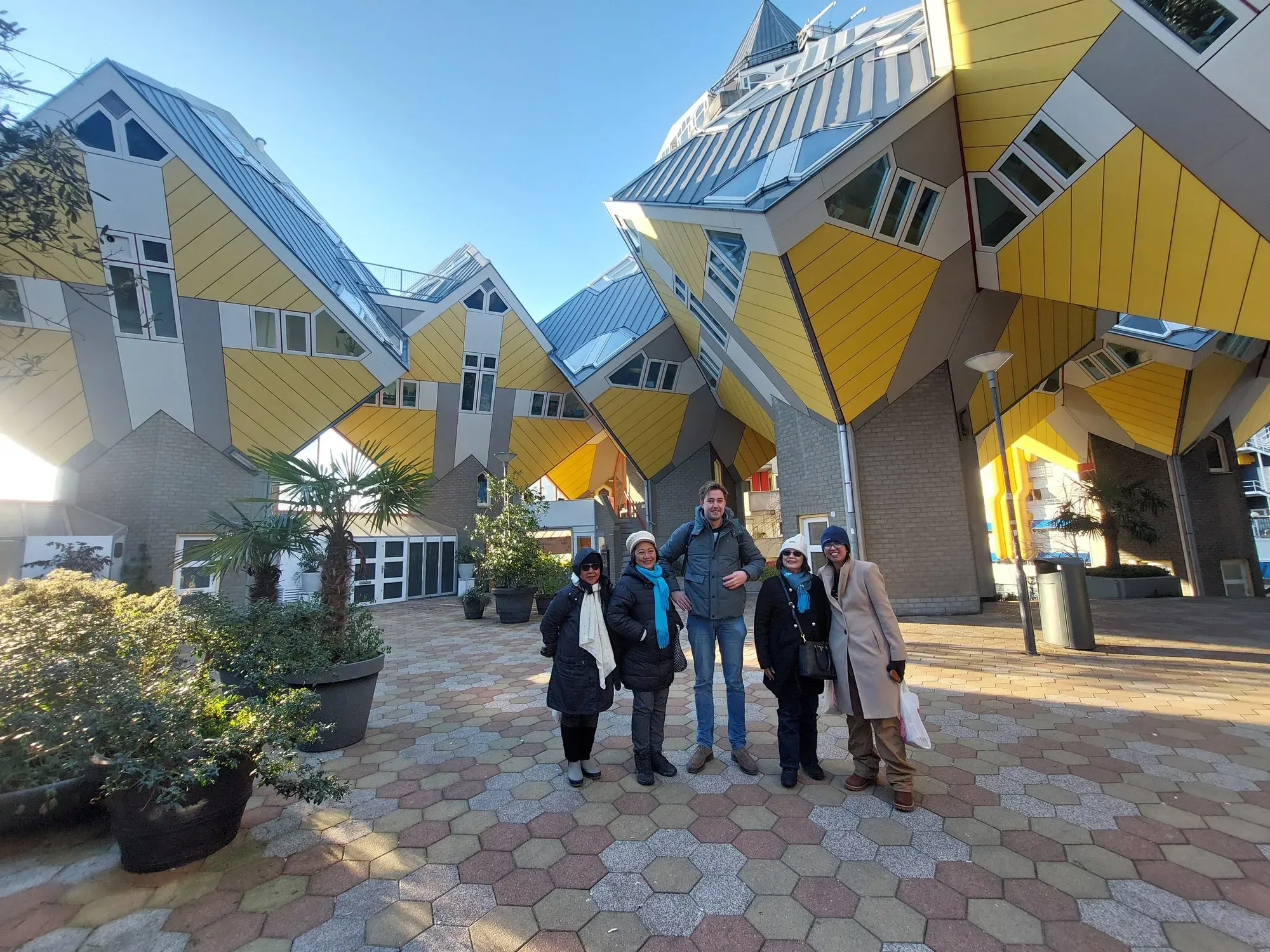 A private tour group with their guide at the Cube Houses near Blaak, Rotterdam