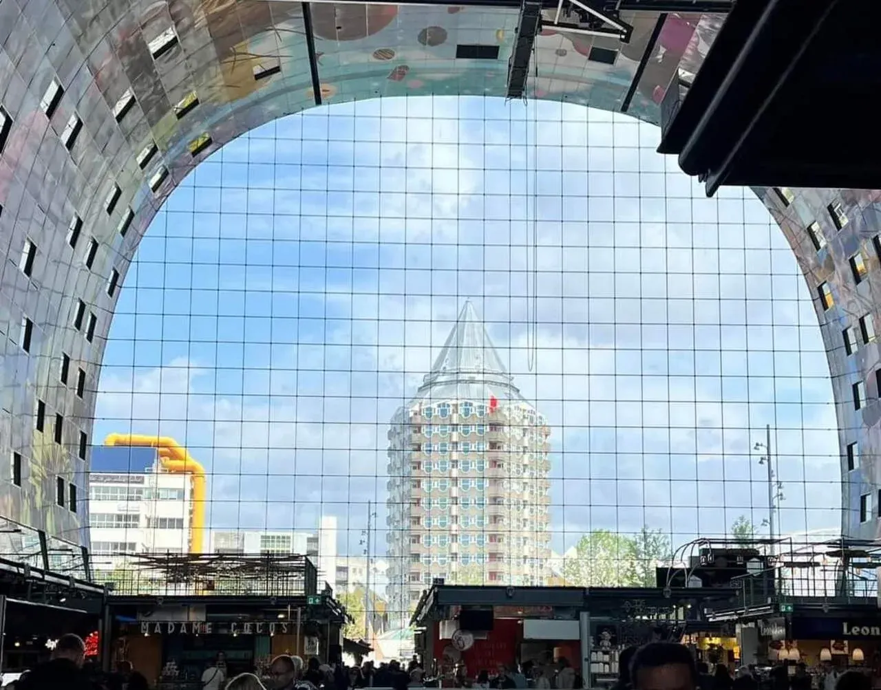 The Markthal in Rotterdam with the Blaaktoren behind it