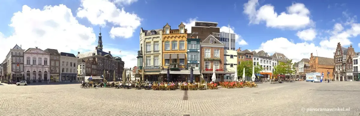 The Markt square in Den Bosch, with cafe terraces in front of the historic gabled houses