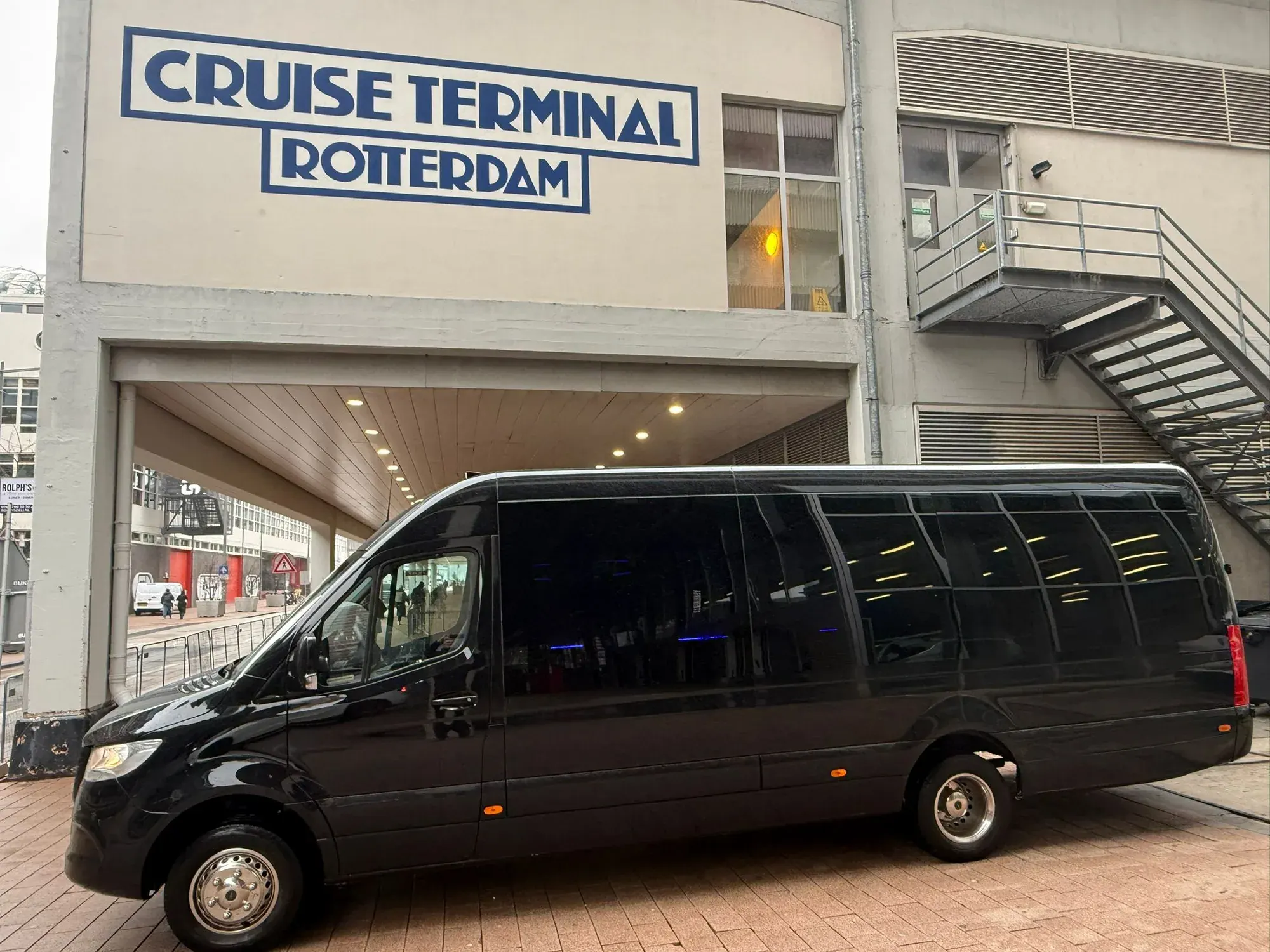 The black Holland City Tours minivan waiting at the Rotterdam cruise terminal