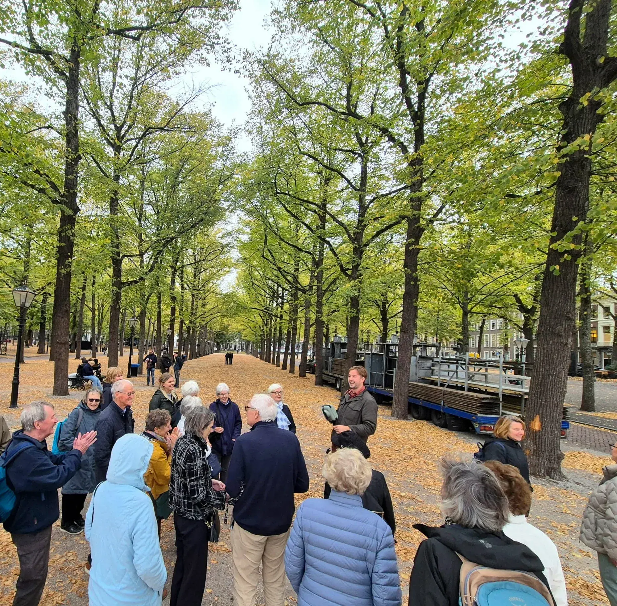 A guide and tour group on the tree-lined Lange Voorhout, The Hague