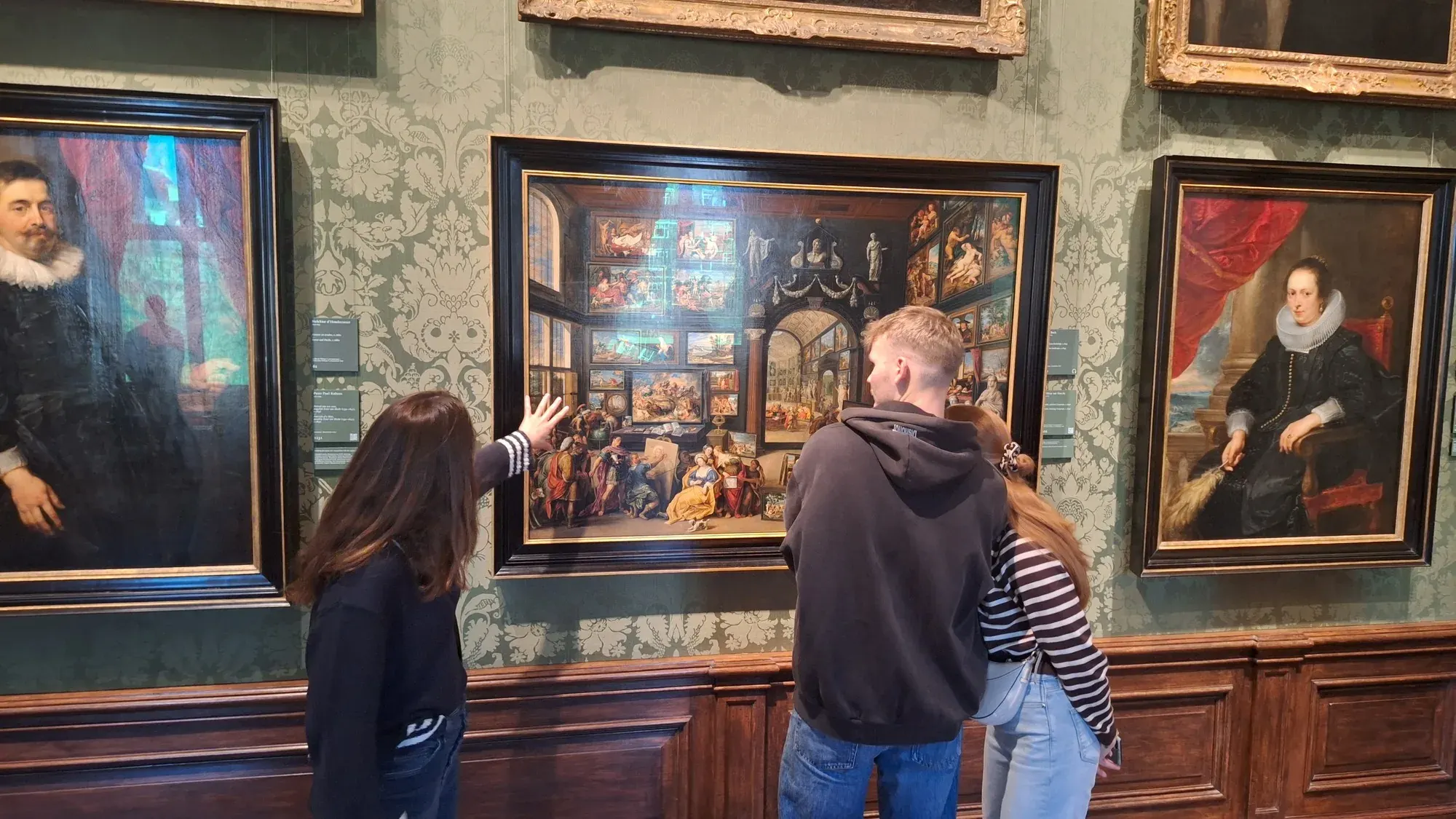 A painted collector's cabinet full of small paintings, studied on a Mauritshuis tour