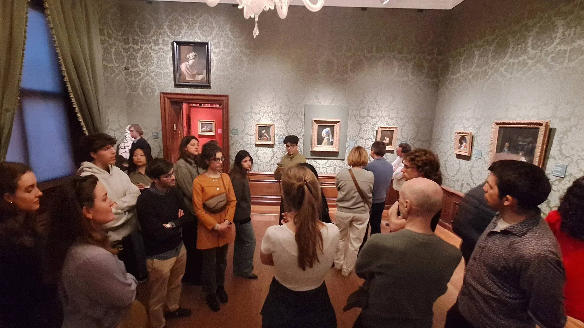 A private group with their guide in the Vermeer room of the Mauritshuis, The Hague