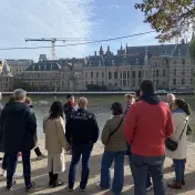 A tour group at the Hofvijver looking across the water to the Binnenhof, The Hague
