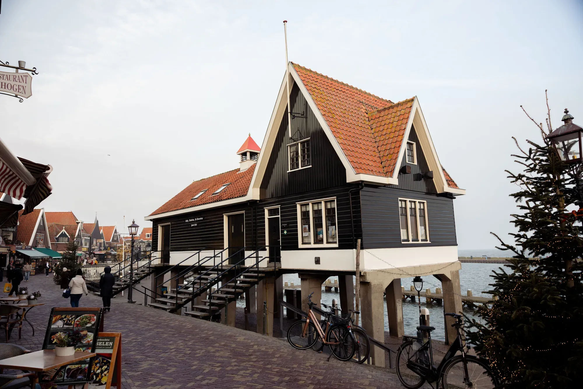 Timber house on stilts at the harbour in Volendam