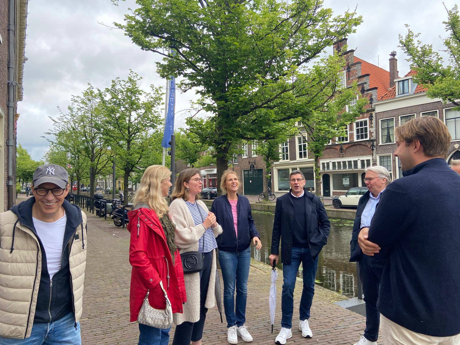 Guide and group in Delft, talking during the walking tour