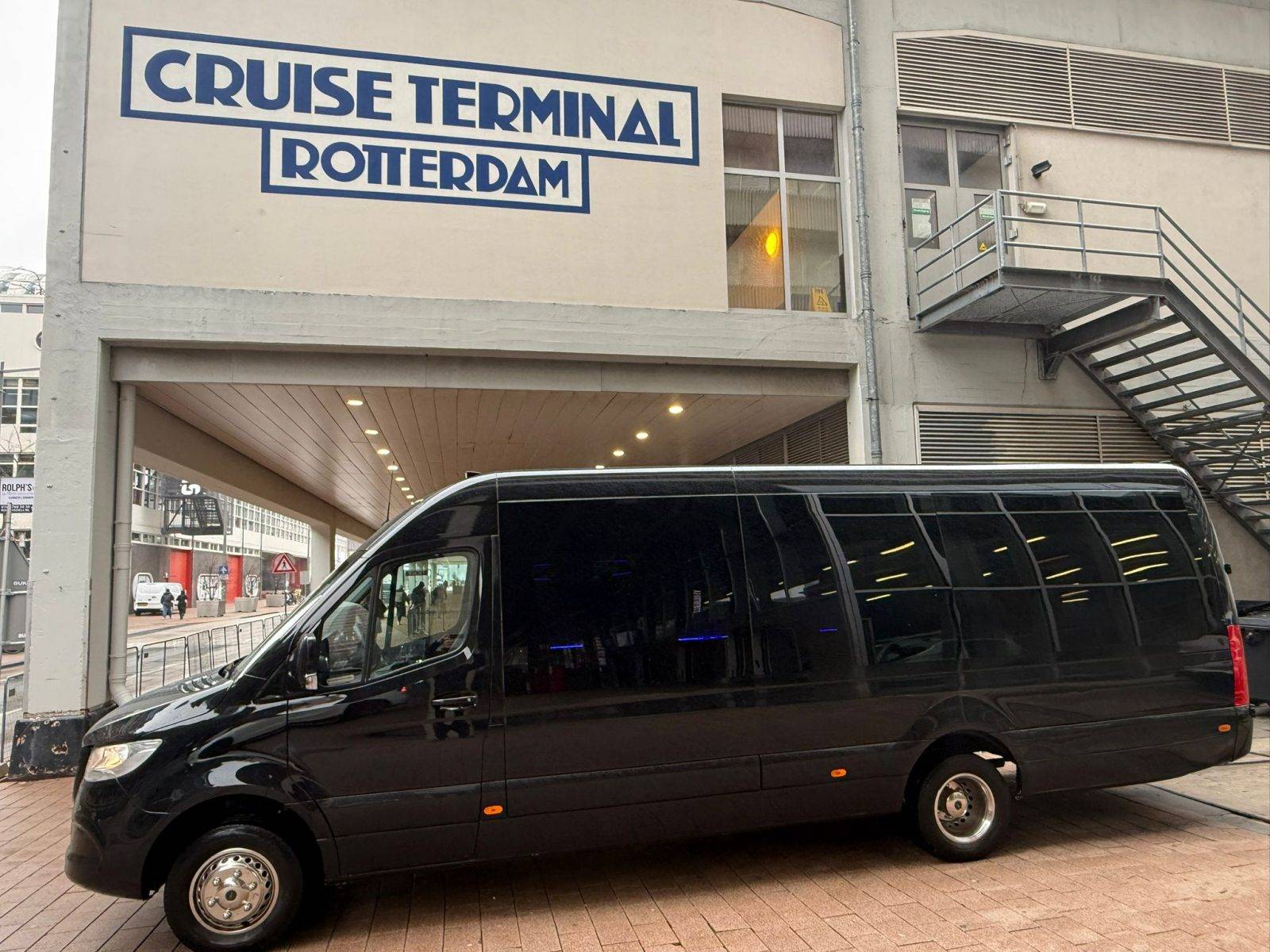 Minivan parked in front of Cruise Port Rotterdam.